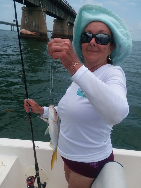 Kathy with a small Yellow Tail Snapper...