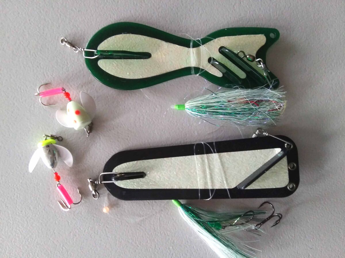 Plastic flashers that rotate and force a lure to "...