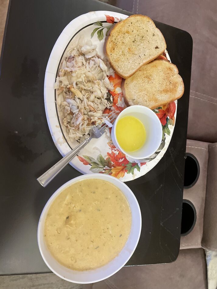 My dinner of crab chowder, garlic bread and crab w...