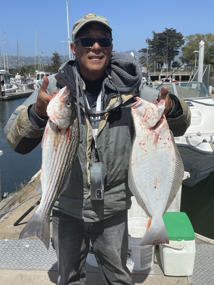 Jim with the 22” halibut and the 23” striper....