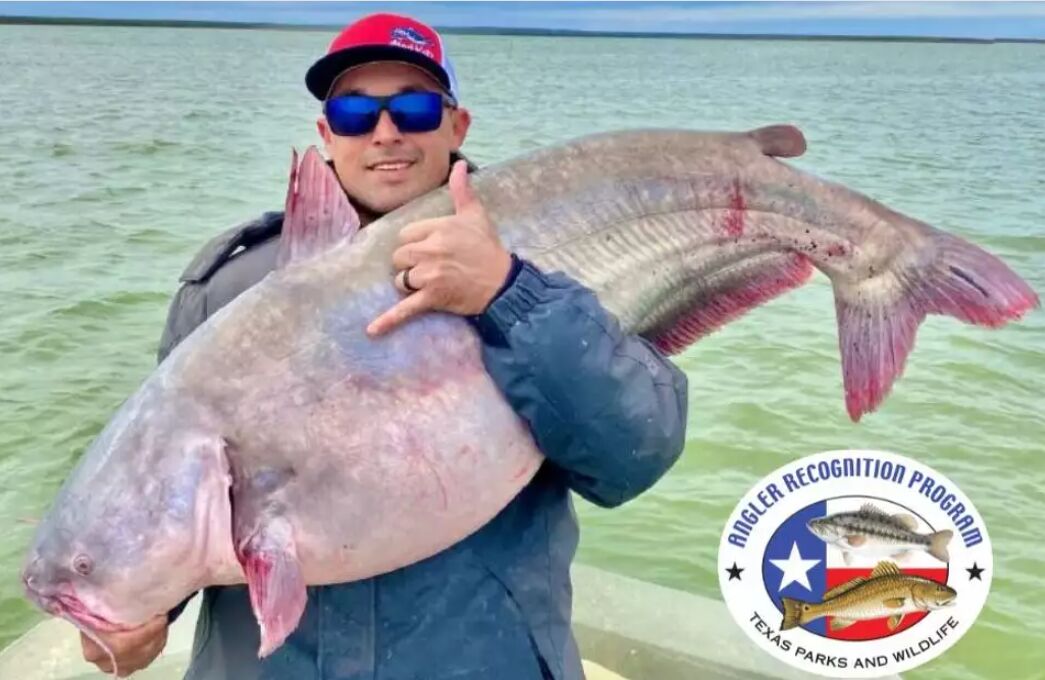 Ricardo Garza caught a 62-pound blue catfish that ...