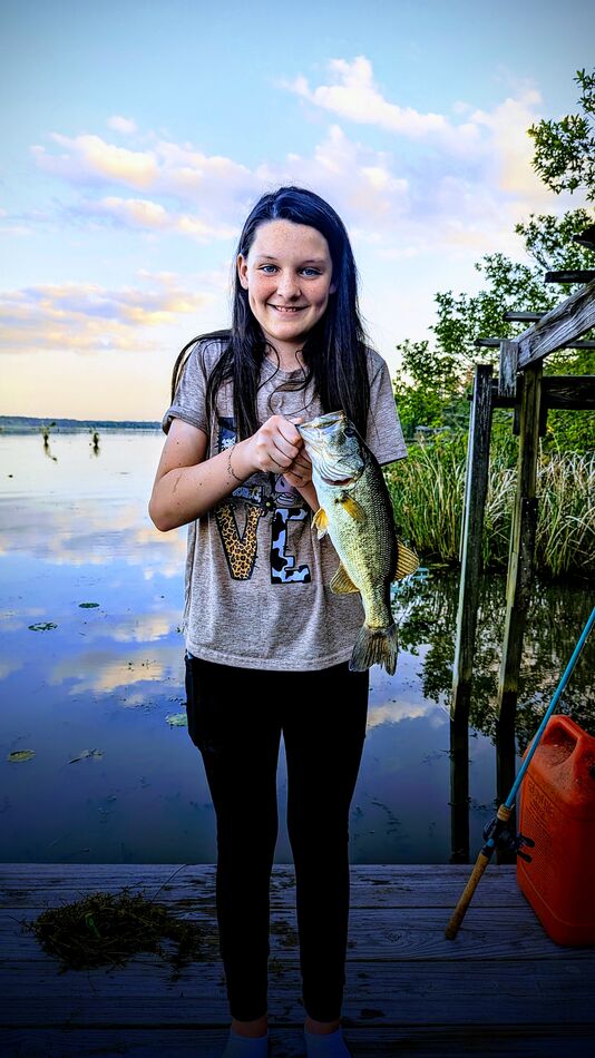 My daughter with her catch from the dock...